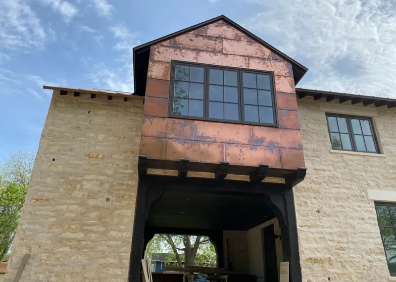 Copper metal panel facade on a stone building for Roof Repair in Mount Lebanon