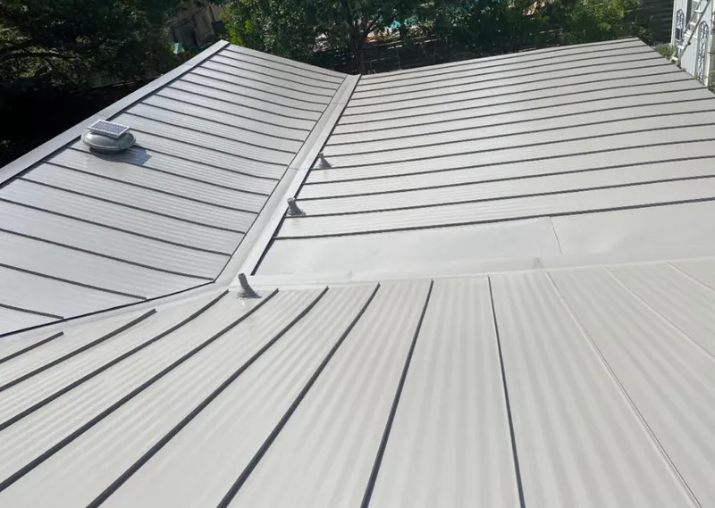 Solar attic fan installed on a metal roof for Roof Ventilation in Mount Lebanon